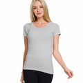 Woman wearing a heather grey t-shirt on a white background