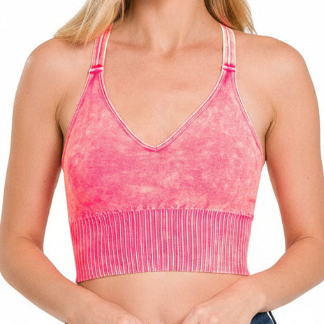 Pink sports bra on a white background